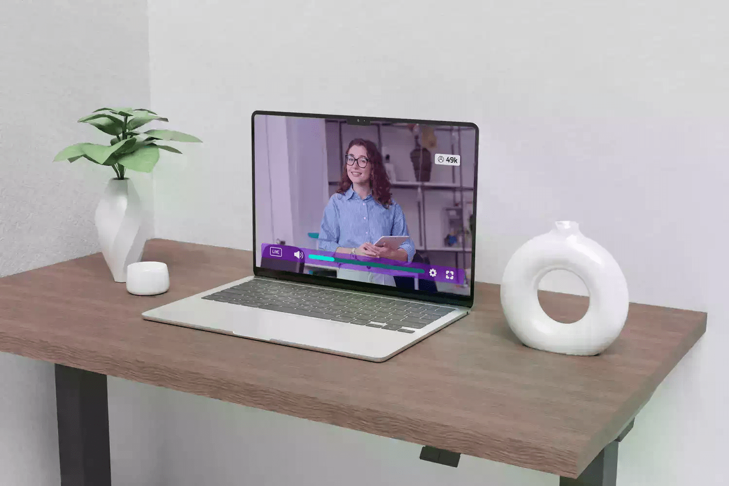 Someone is watching a video that was created in a new studio setup. The video is now being hosted on Cinema8's platform.